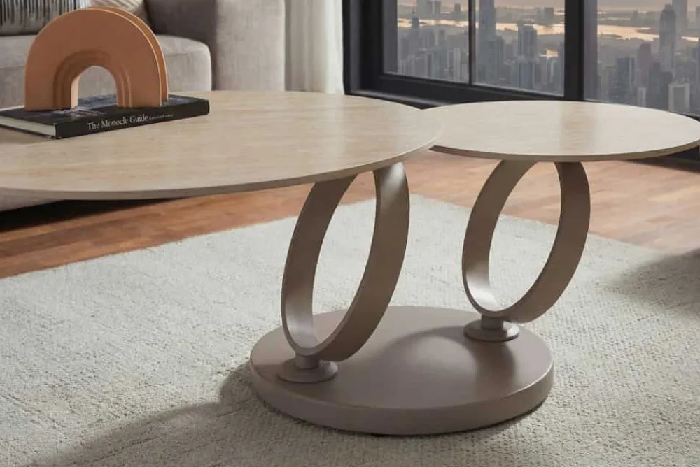 Riess-Ambiente Couchtische & Truhen > Design Couchtisch DANCING RINGS natur rund drehbar Travertin Keramik champagner greige