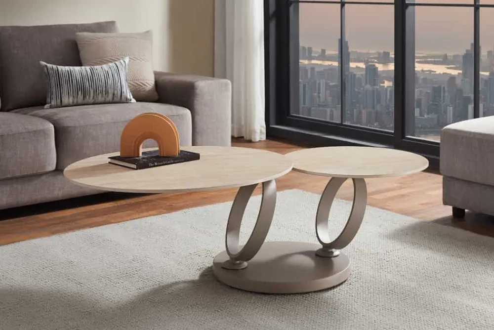 Riess-Ambiente Couchtische & Truhen > Design Couchtisch DANCING RINGS natur rund drehbar Travertin Keramik champagner greige