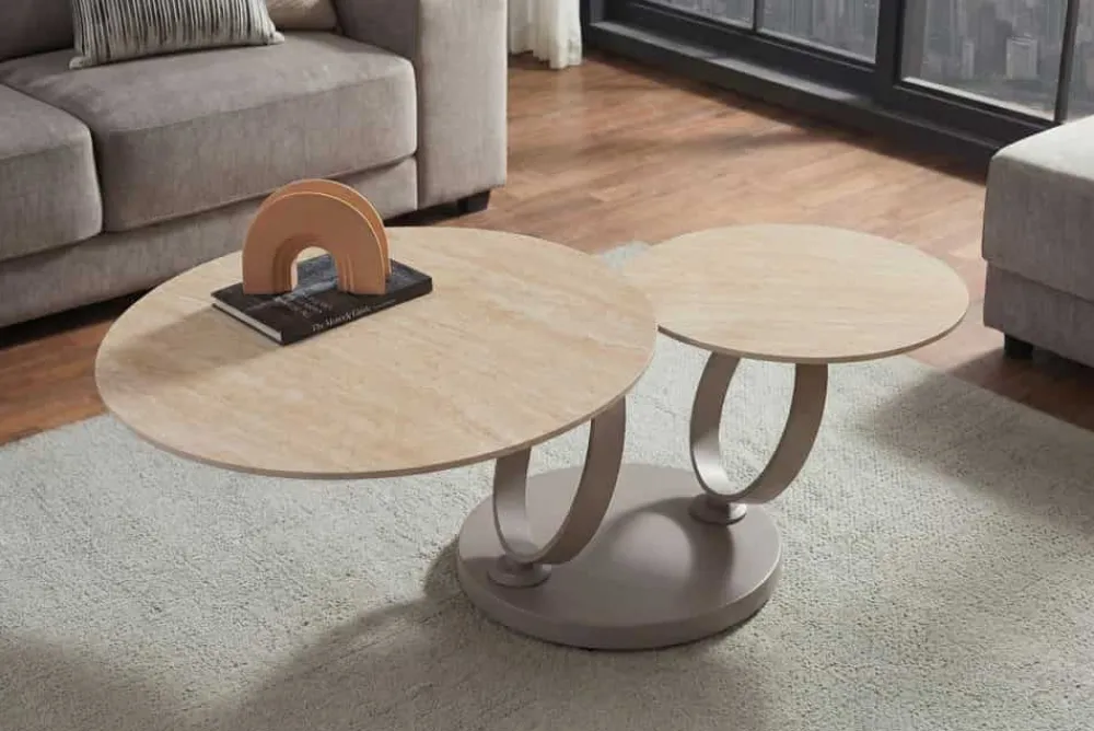 Riess-Ambiente Couchtische & Truhen > Design Couchtisch DANCING RINGS natur rund drehbar Travertin Keramik champagner greige