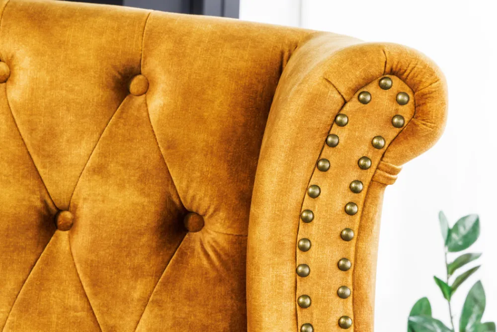 Riess-Ambiente Sessel|Samt Möbel > Design Ohrensessel CHESTERFIELD 85cm senfgelb Samt Knopfheftung