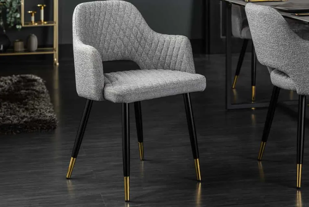 Riess-Ambiente Retro Möbel|Stühle > Design Stuhl PARIS hellgrau Strukturstoff mit Armlehnen Ziersteppung goldene Fußkappen